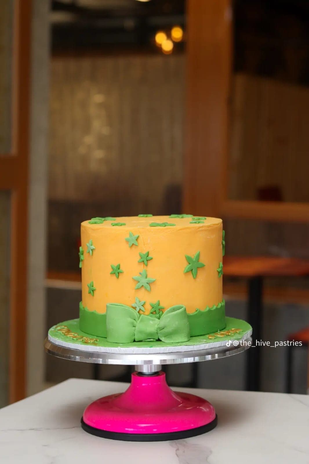 Orange and green star cake from the bakery's feed